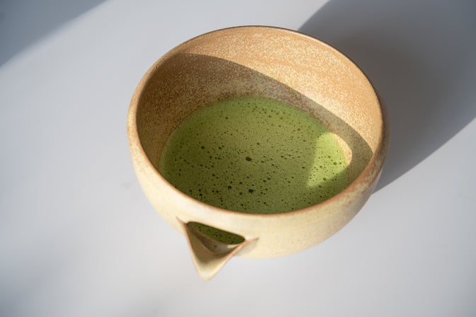 Modern Matcha Bowl (Ochre) in natural light.