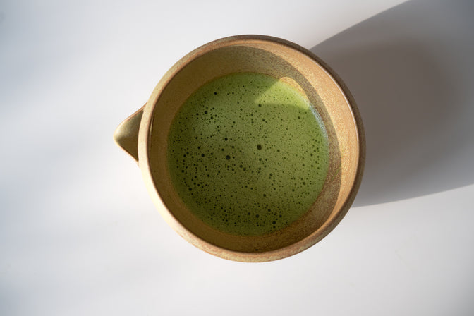 Modern Matcha Bowl (Ochre) in natural light.